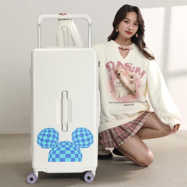 Model posing with white MICKEY suitcase, highlighting stylish travel design for wholesale