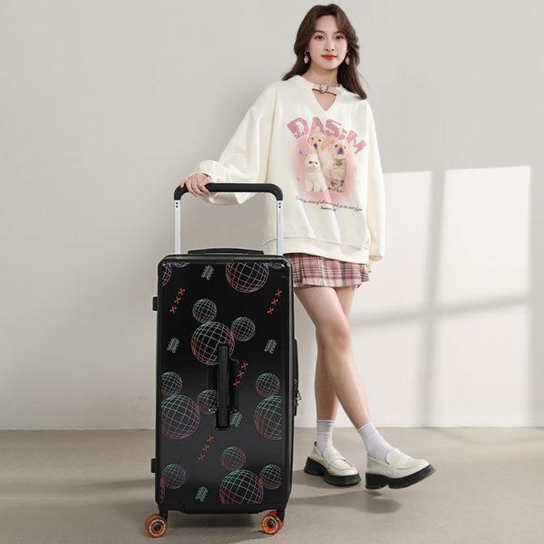 Person showcasing black MICKEY suitcase, emphasizing stylish, travel - ready design for IP - licensed wholesale