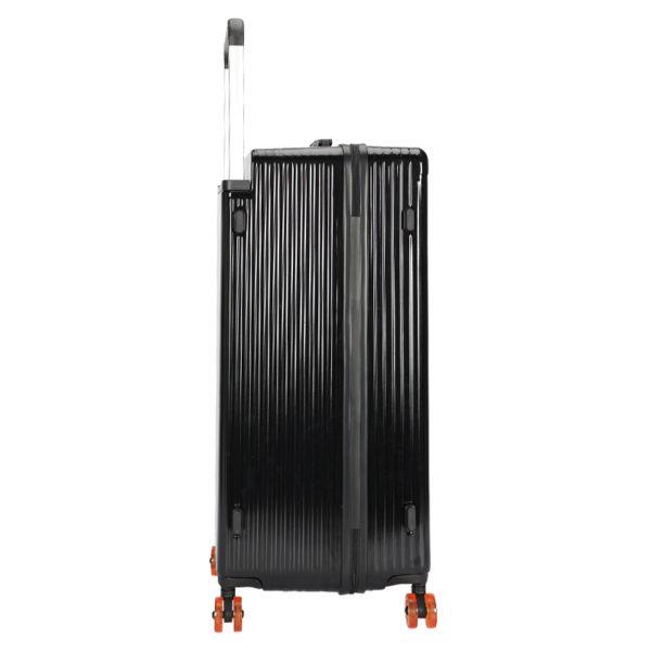 Person pulling large black MICKEY suitcase, emphasizing travel - ready functionality for wholesale