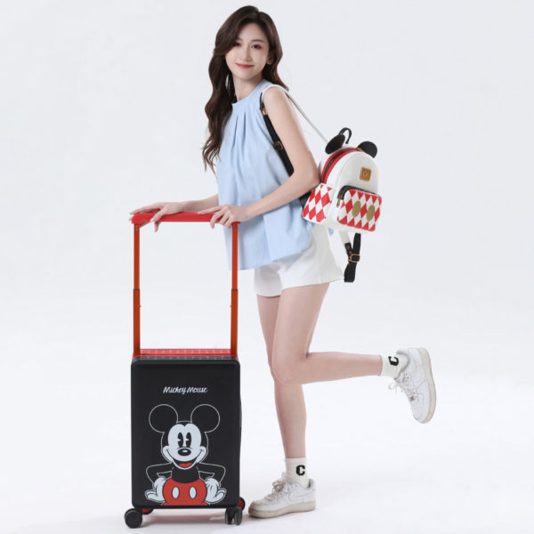 Model with red and black Mickey suitcase, highlighting travel - ready style for Disney IP - licensed wholesale