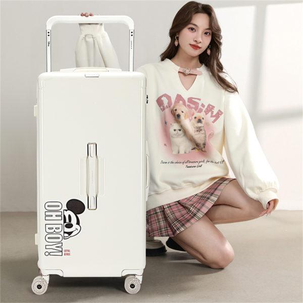 Model with white MICKEY suitcase, highlighting travel - ready functionality for wholesale under Disney IP