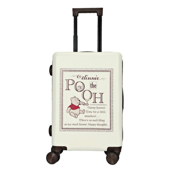 Side view of the Winnie the Pooh 20-inch suitcase, showing the durable design with four wheels and adjustable handle.